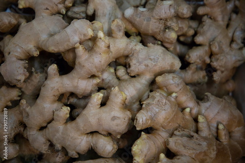 heap of ginger vegetable in market .