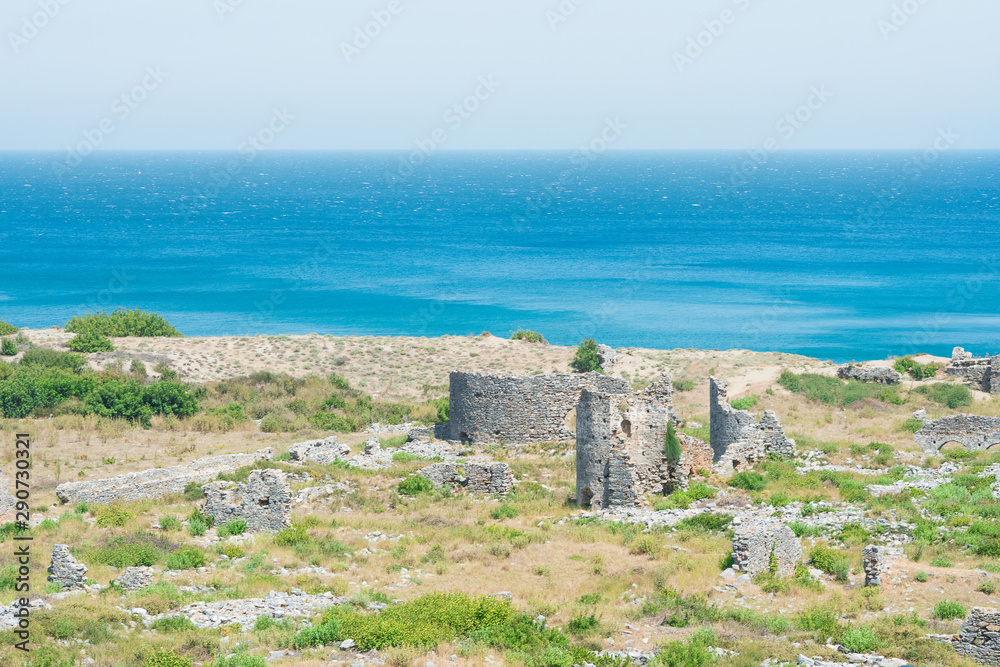 Beautiful seascape, ruins of ancient city Anemurium. Anamur, Turkey, Mediterranean sea.