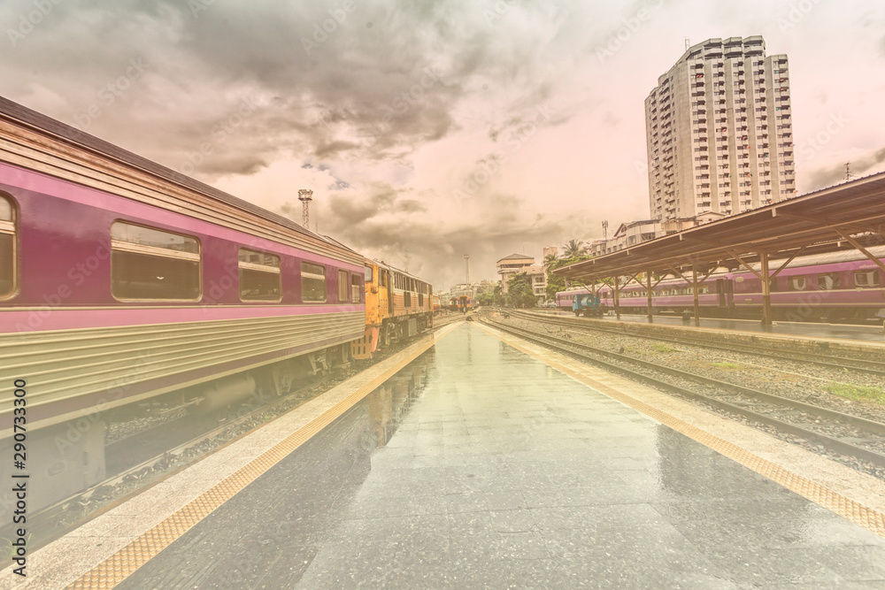 Obraz premium train station with train waiting for tourists to travel out of the province on weekends to relax