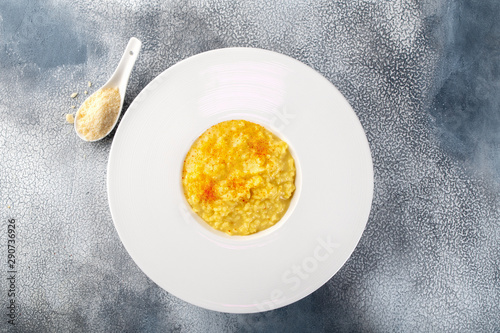 Canvas Print Risotto Milanese with saffron and parmesan cheese