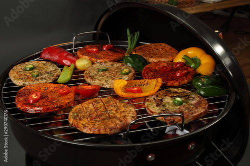 Grilled burgers and grilled vegetables. Grilled meat and vegetables.