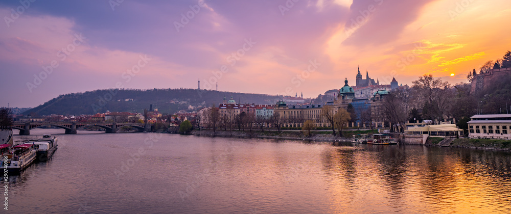 Scenic Panorama of the Old Town Architecture with Vltava River, Charles Bridge and St.Vitus Cathedral in Prague, Czech Republic, Sunset Time