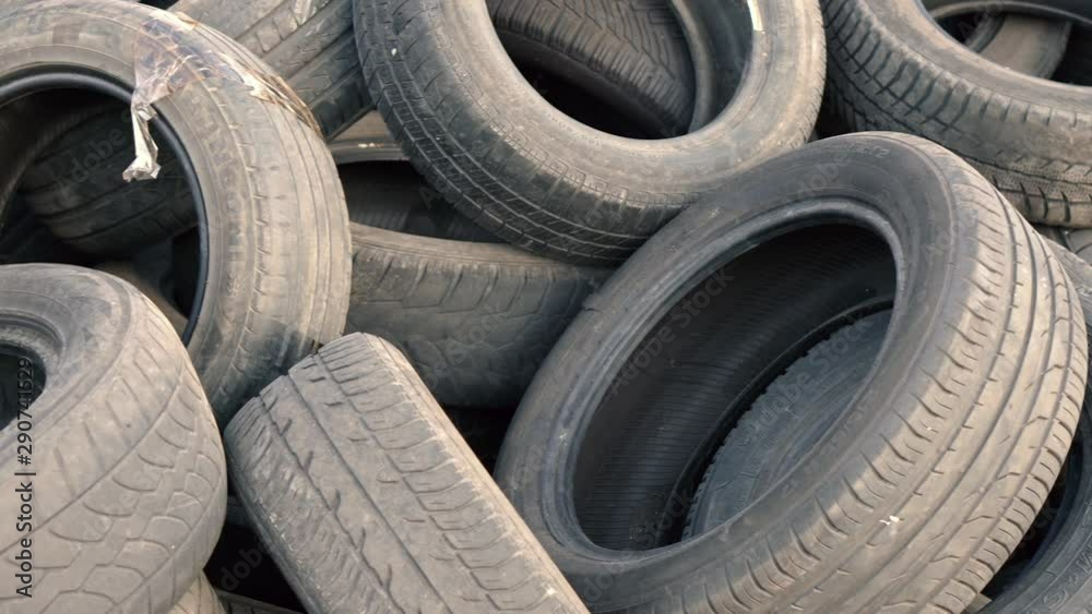 Landfill of old car tires. Close-up. Wheel tires. Seasonal car tire replacement Landfill of old car tires. Close-up. Wheel tires. Seasonal car tire replacement