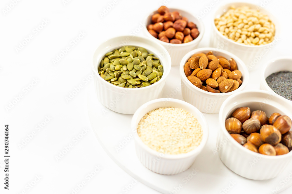Top View of Variety of Nuts and Seeds on the White Background, Free Space for Text