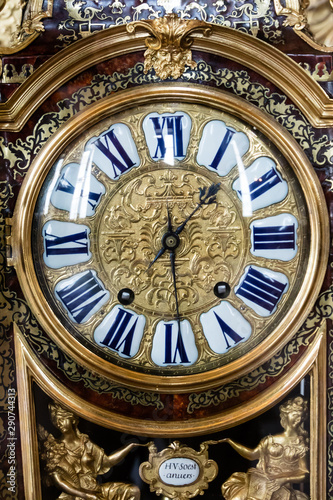 Gilt and enamel face of an antique clock