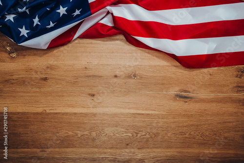 American flag on a old wooden. Symbol of freedom and democracy. Independence day. © Nana_studio