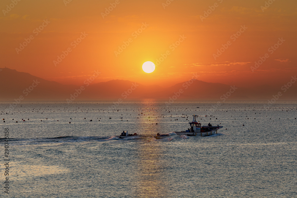Fototapeta premium a beautiful scene of sunrise at a harbor, Jin-do island, south Korea