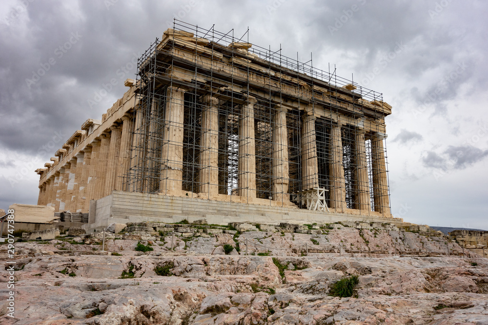 Famous Parthenon at Greek Acropolis under reconstruction in overcast weather