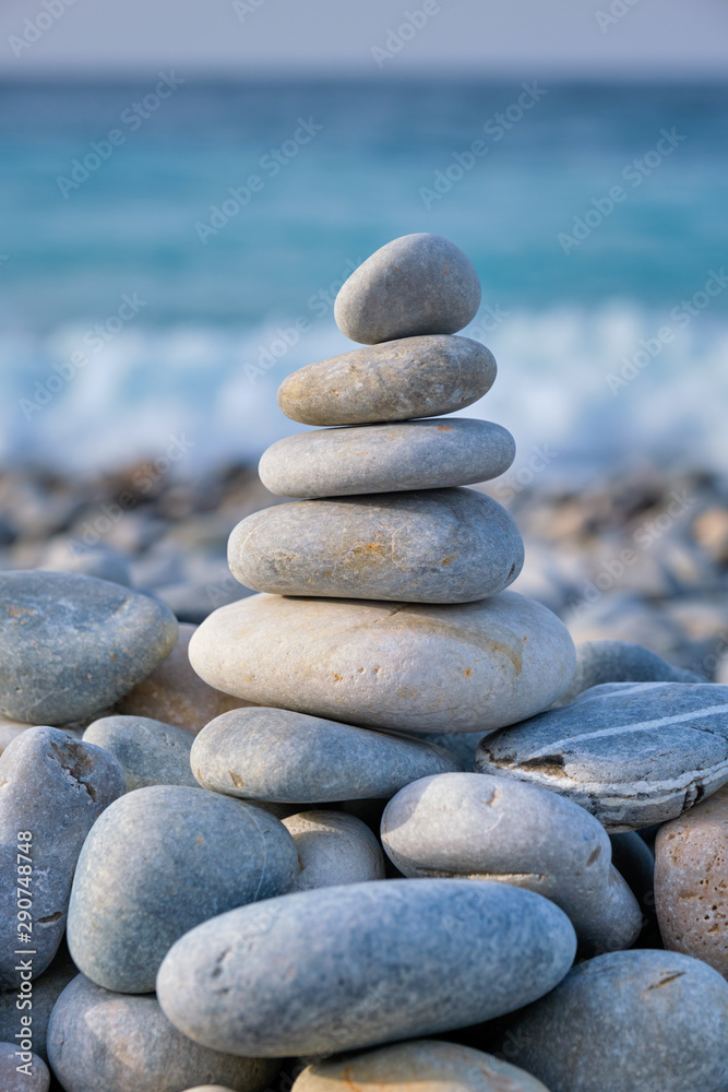 Zen balanced stones stack on beach Zen balanced stones stack on beach