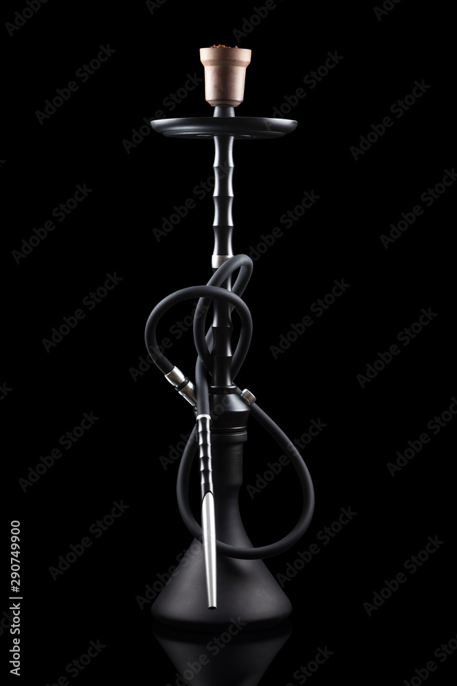 Modern hookah, made with the latest technology on a beautiful dark background. Isolated vertical image. Modern hookah, made with the latest technology on a beautiful dark background. Isolated vertical image.