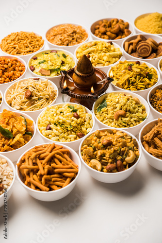 Rangoli of Farsan/snacks in bowls for Diwali with diya