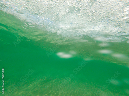 Bubbles under the water of a river © nikolay100