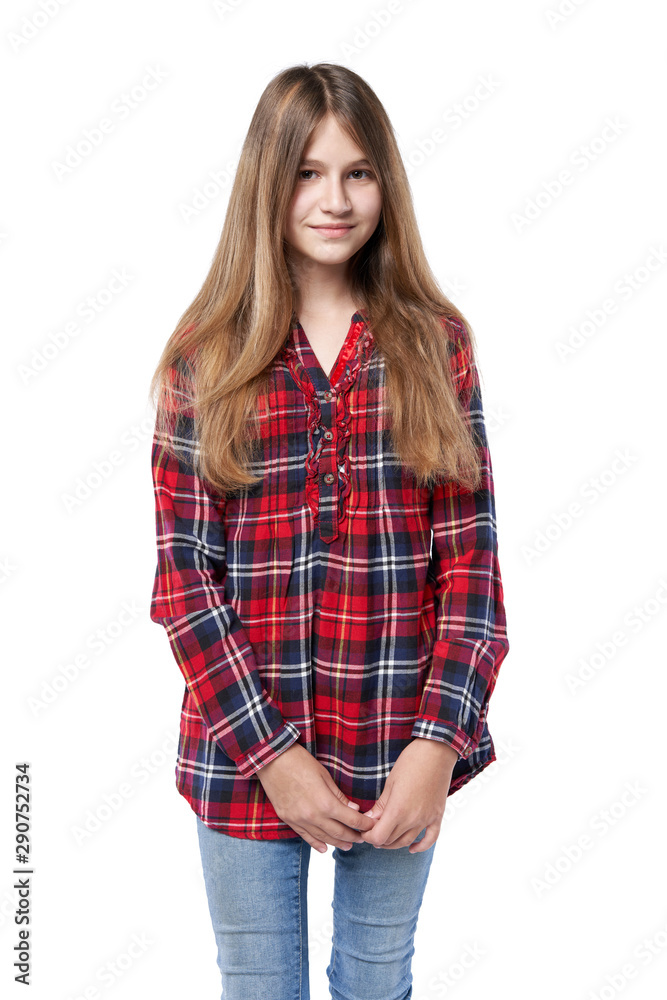 Teen girl in checkered shirt standing casually Teen girl in checkered shirt standing casually