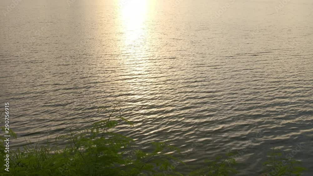 Background Water surface and sunlight during sunset time Background Water surface and sunlight during sunset time
