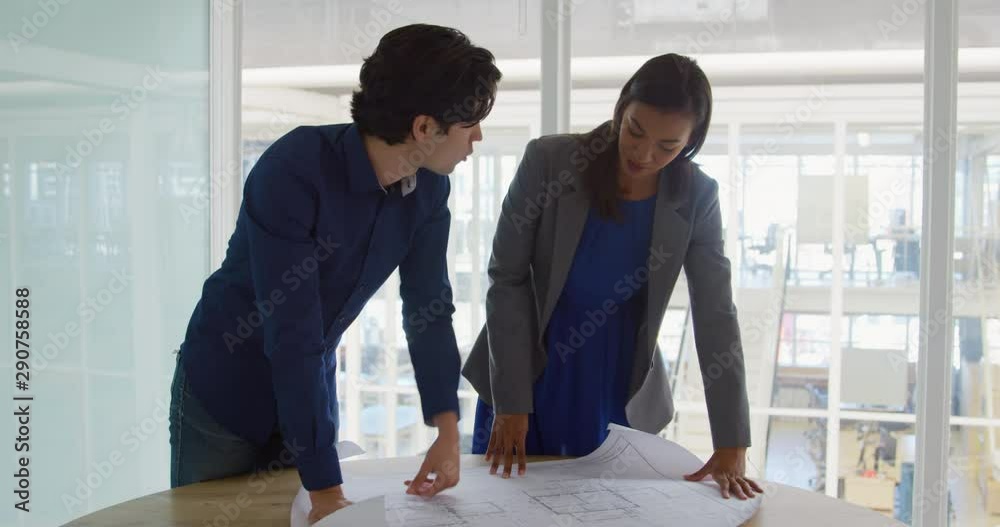 Young man and woman working in a creative office Young man and woman working in a creative office