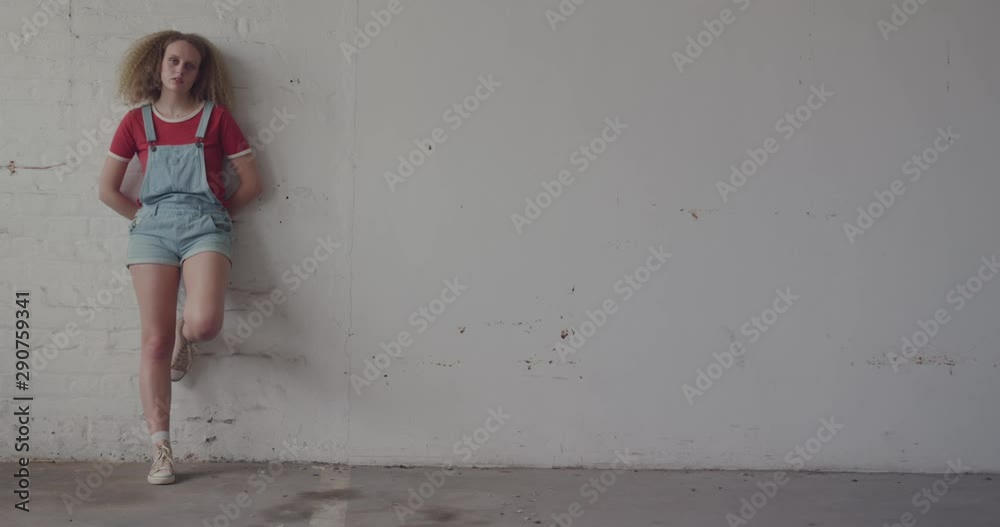 Fashionable young woman in an abandoned warehouse Fashionable young woman in an abandoned warehouse