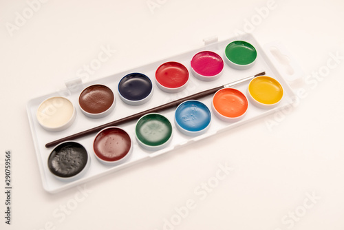 watercolor paints in box on white background