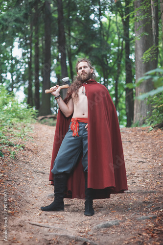 Brave Warrior Viking man with iron axe outdoor