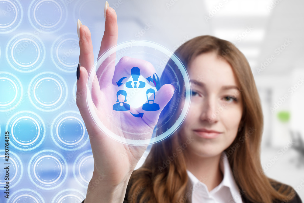 The concept of business, technology, the Internet and the network. A young entrepreneur working on a virtual screen of the future and sees the inscription: The concept of business, technology, the Internet and the network. A young entrepreneur working on a virtual screen of the future and sees the inscription: