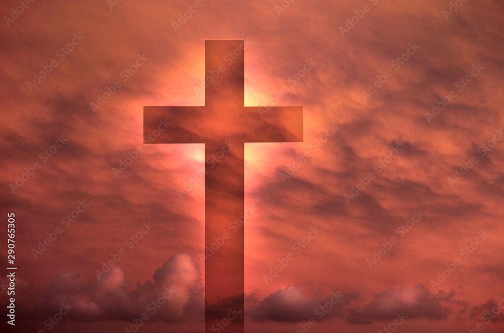 Cross from the blue sky against a background of dark clouds