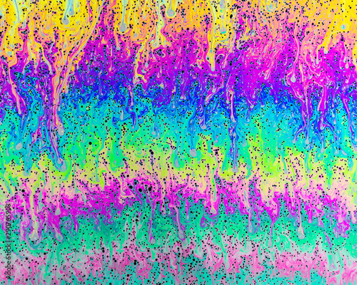 A creative abstract swirling liquid rainbow of colours that looks like watercolour paints or inks that makes an interesting vibrant layered separation background