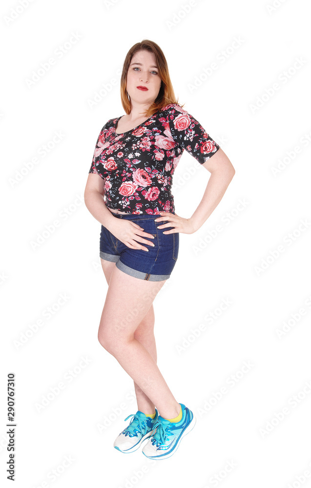 Beautiful young woman standing in shorts Beautiful young woman standing in shorts