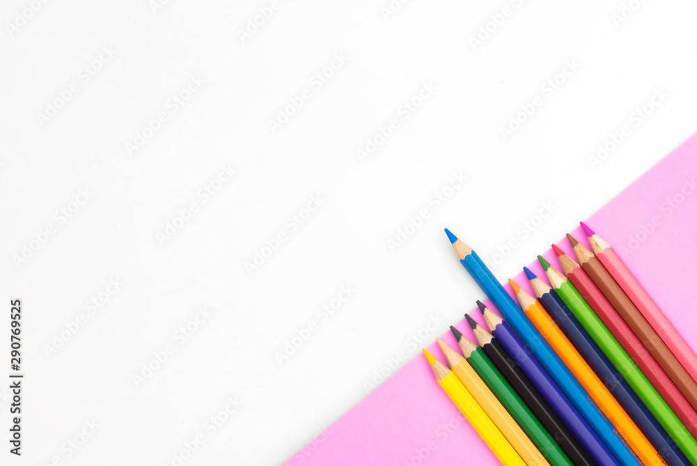 Fototapeta premium colorful pencils on green part paper on white background with copy space