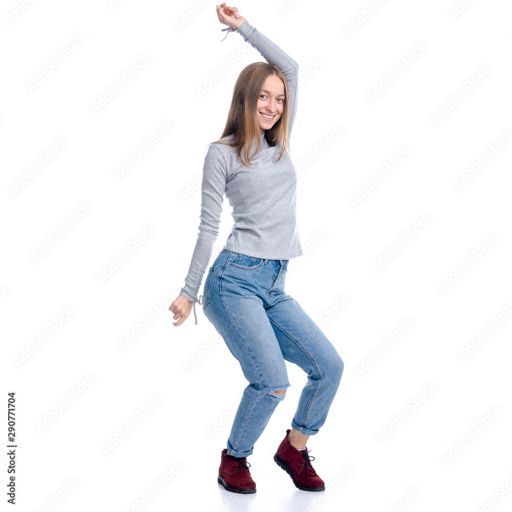 Woman in jeans and gray shirt smiling standing happiness dancing on white background isolation Woman in jeans and gray shirt smiling standing happiness dancing on white background isolation
