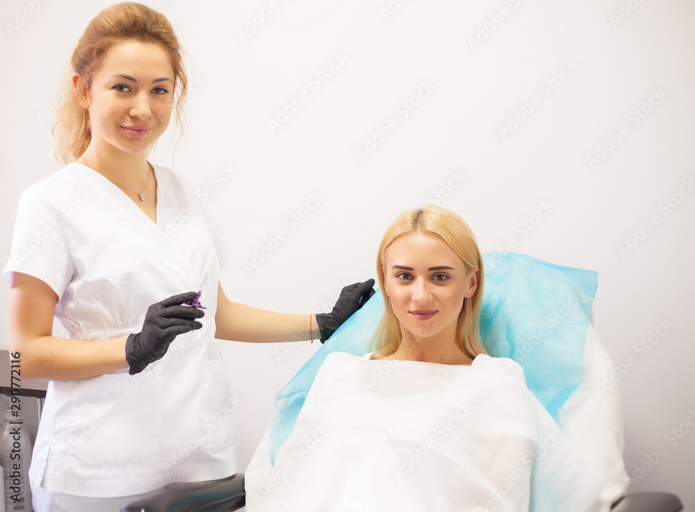 Fototapeta premium Lip Augmentation In Cosmetology Clinic. Beautiful Woman Getting Beauty Injection For Lips