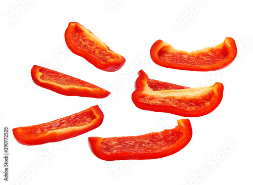 Cut slices of red sweet bell pepper isolated on white background.Clipping Path