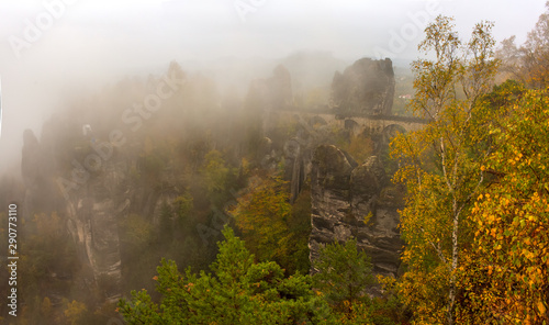 Amazing scenery of the Bastei bridge, Saxon Switzerland National Park, Germany. Autumn foggy day © haidamac