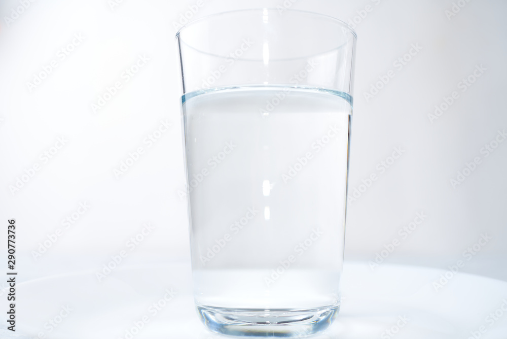 water glass isolated on a blue background water glass isolated on a blue background