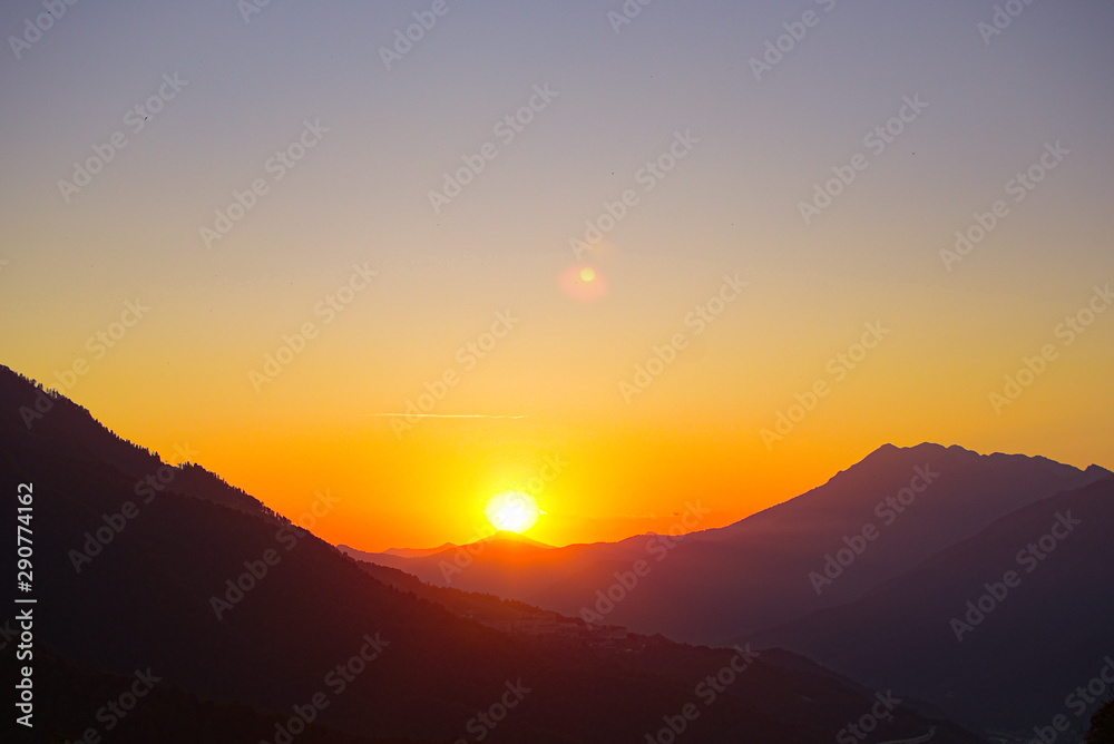 Fototapeta premium Sunset mountain valley hills landscape. Mountain valley sunset panorama.