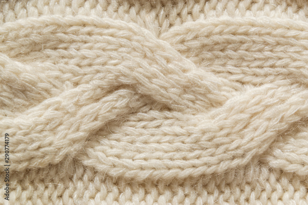 The closeup texture of cashmere things. Macro shot of knitted fabric from Lana Wool threads. Warm winter clothes. Background textile surface with copy space for text. The closeup texture of cashmere things. Macro shot of knitted fabric from Lana Wool threads. Warm winter clothes. Background textile surface with copy space for text.