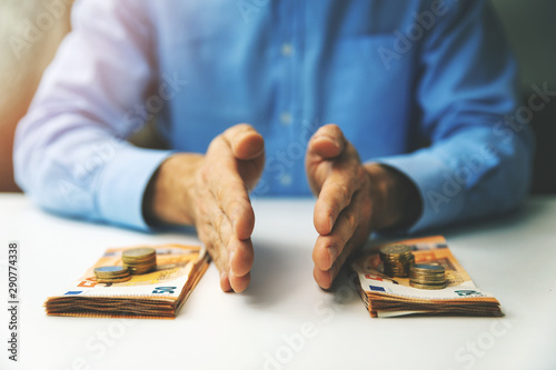 Fotografija finance management and budget planning concept - businessman splitting the money