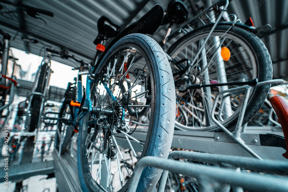 Many bicycle in a row. Bicycle parking at the street