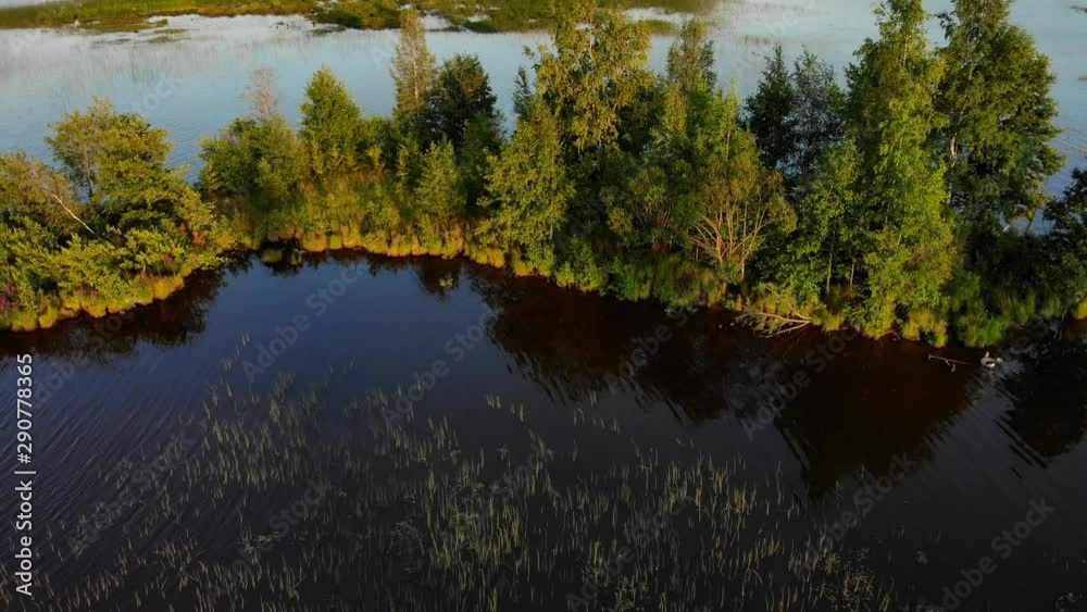 Aerial video over lake and island in Leningrad region 4K