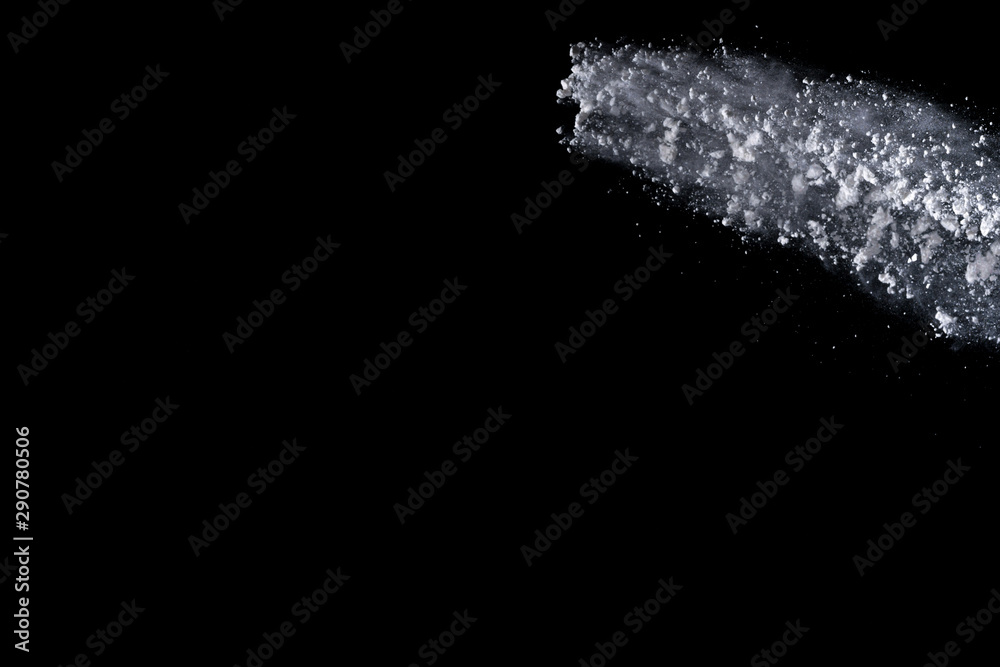 White powder explosion isolated on black background 