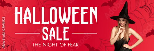Young blonde woman in black hat on scary red background. Attractive caucasian female model smiling. Halloween sales  black friday  cyber monday  sales  autumn concept. Flyer for your ad. Secrets.