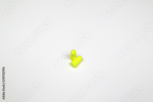 green earplug isolated on white background © Miroslav