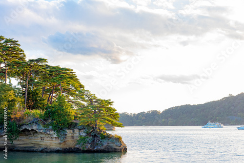 Matsushima Bay in dusk, beautiful islands covered with pine trees and rocks. One of the Three Views of Japan, and is also the site of the Zuigan-ji, Entsu-in and Kanrantei. in Miyagi Prefecture, Japan photo