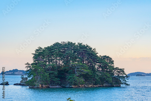 Matsushima Bay in dusk, beautiful islands covered with pine trees and rocks. One of the Three Views of Japan, and is also the site of the Zuigan-ji, Entsu-in and Kanrantei. in Miyagi Prefecture, Japan photo