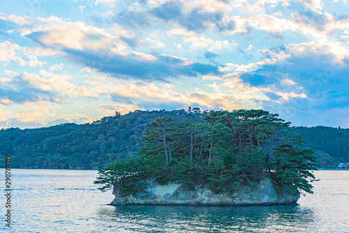 Matsushima Bay in dusk, beautiful islands covered with pine trees and rocks. One of the Three Views of Japan, and is also the site of the Zuigan-ji, Entsu-in and Kanrantei. in Miyagi Prefecture, Japan photo