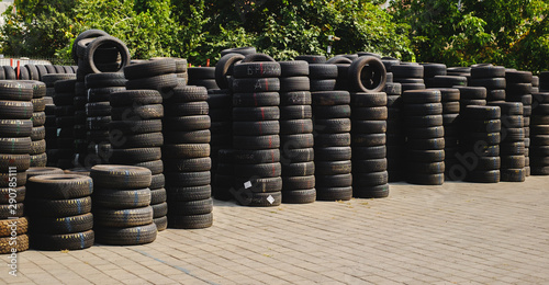 Used tire stacks in Workshop vulcanization yard photo