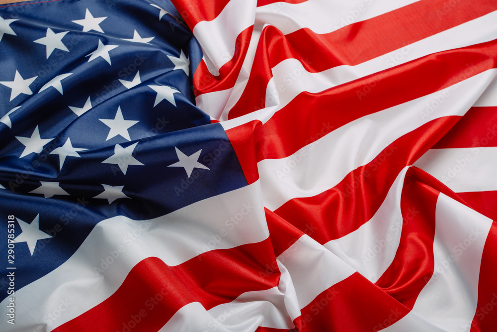 Obraz premium Flag of the United States of America closeup. Symbol of freedom and democracy. Independence day. American flag waving in the wind.