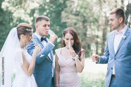 drinking champagne from glasses in the park © Mallivan