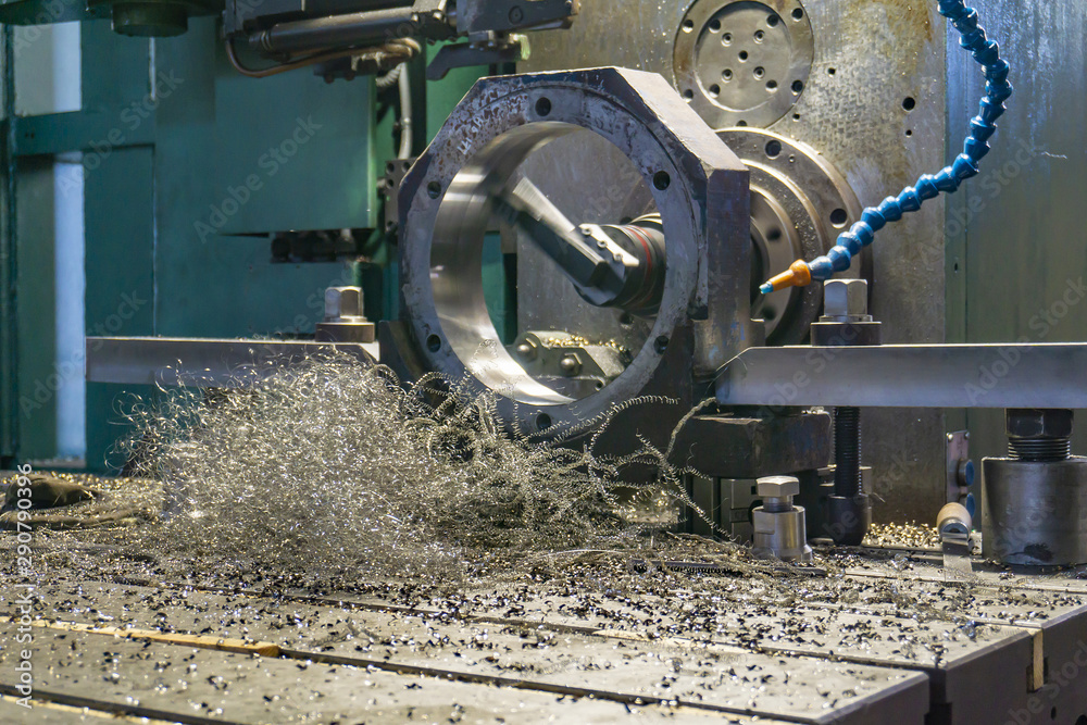 Processing of parts on a CNC boring machine, shavings lie on the machine.