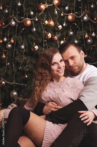 couple near a Christmas tree