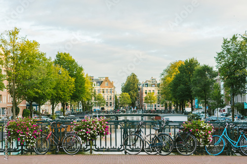 Bicycle parked on a bridge above the water in Amsterdam © LS Visuals