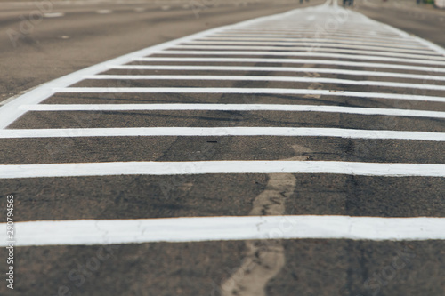 Double solid strip on the road. Two white stripes on the asphalt.